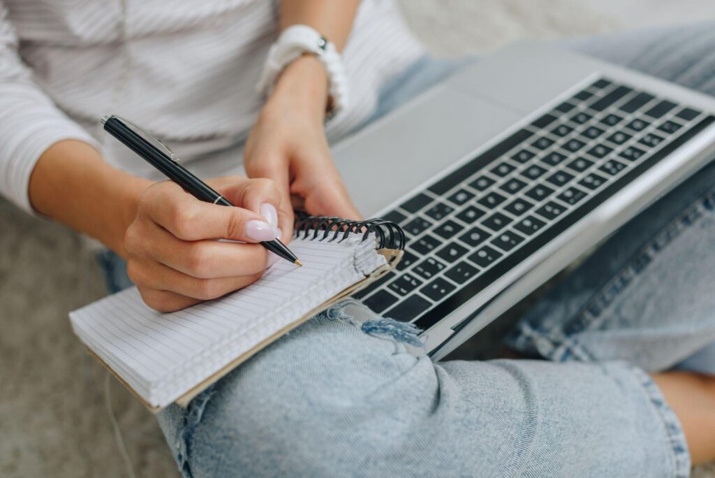 woman writing in a journal